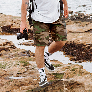 Man walking with camera. cargo shorts for men relaxed fit cargo shorts for men black cargo shorts