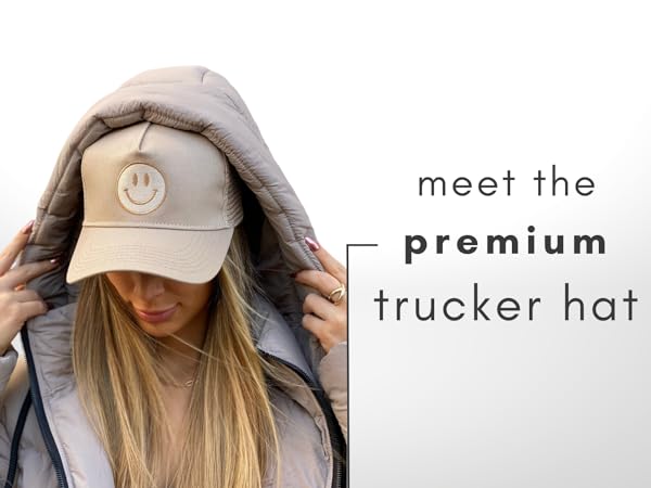 Meet the premium trucker hat by citrusy boutique! Woman model, with tan smiley trucker hat.