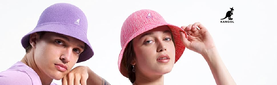 A man in a purple bucket hat and a woman in a pink bucket hat.