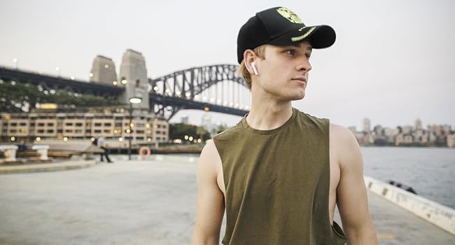 The gold embroidered baseball cap added elegance to his simple emphasis.