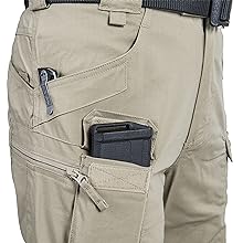 Cargo pockets, velcro closed pockets and side pockets. Reinforced edge for pocket knifes