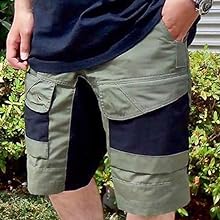 man putting his hand in the shorts pocket