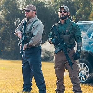 Two men holding guns