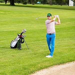 a man playing golf wearing trucker hat