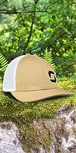 a solid trucker hat above the rocks forest