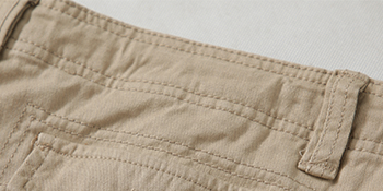 The back pockets of these mens shorts have flap buttons to protect your things from falling