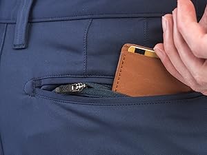 Hand sliding wallet into Rhone Mens Commuter Dress Pants Hidden Zipper Pocket