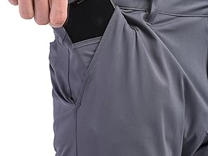 Image showing phone sliding into Rhone Mens Commuter Classic fit pants hidden media pocket