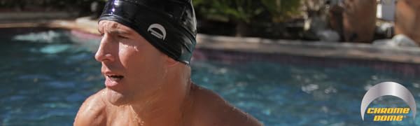 Man in a swimming pool wearing a black Chrome Dome Cap with the Chrome Dome logo on the right side.