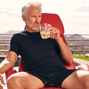 6 inch boxer brief and lounge shirt silver fox wearing in a chair