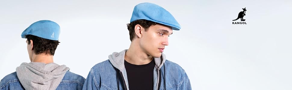 Kangol logo. A model in a blue men’s Tropic hat.